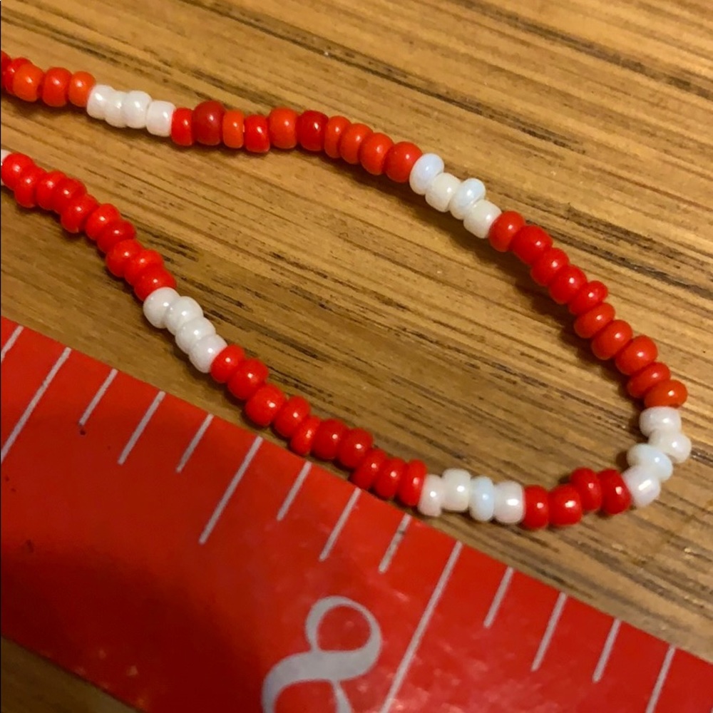 Necklace orange & white small beads. 16” long.